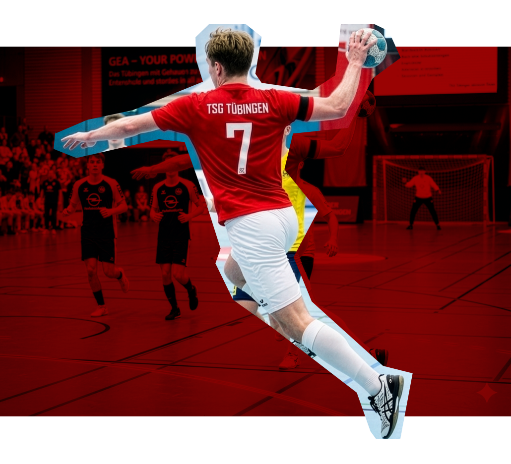 Ein Handballspieler in rotem Trikot mit der Nummer 7 springt in einem Sportzentrum.